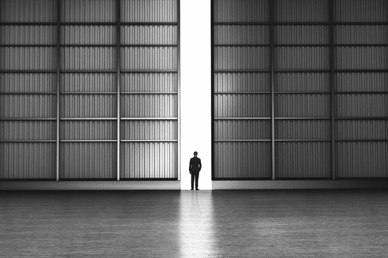 Photo: person standing outside hangar