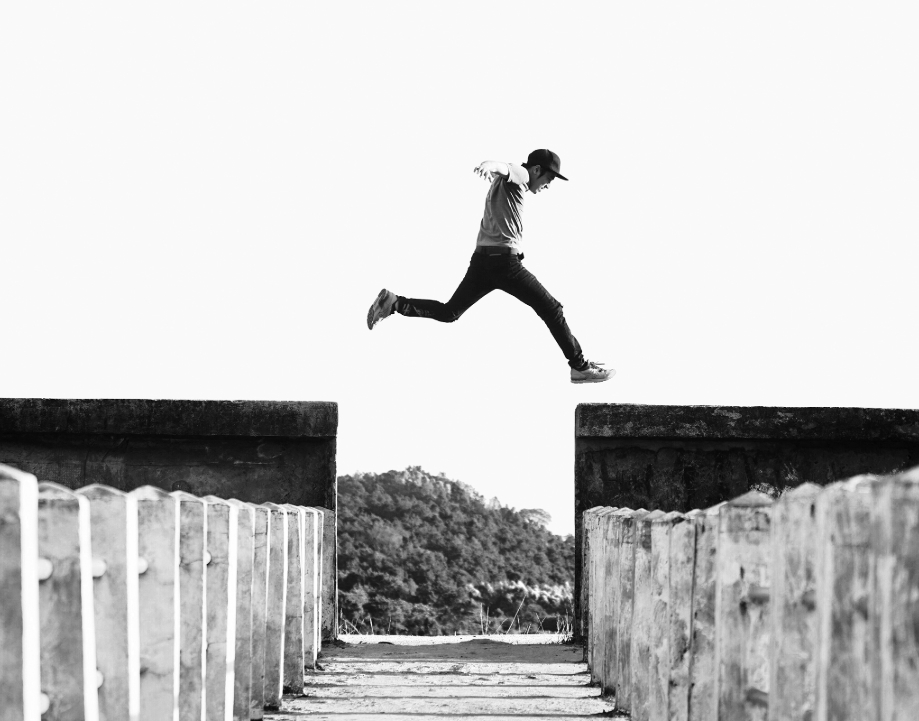 Man jumping over wall.