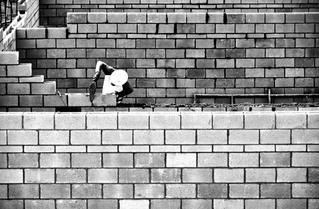 Construction worker building a wall