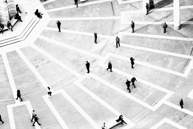 Aerial shot of people walking in public square